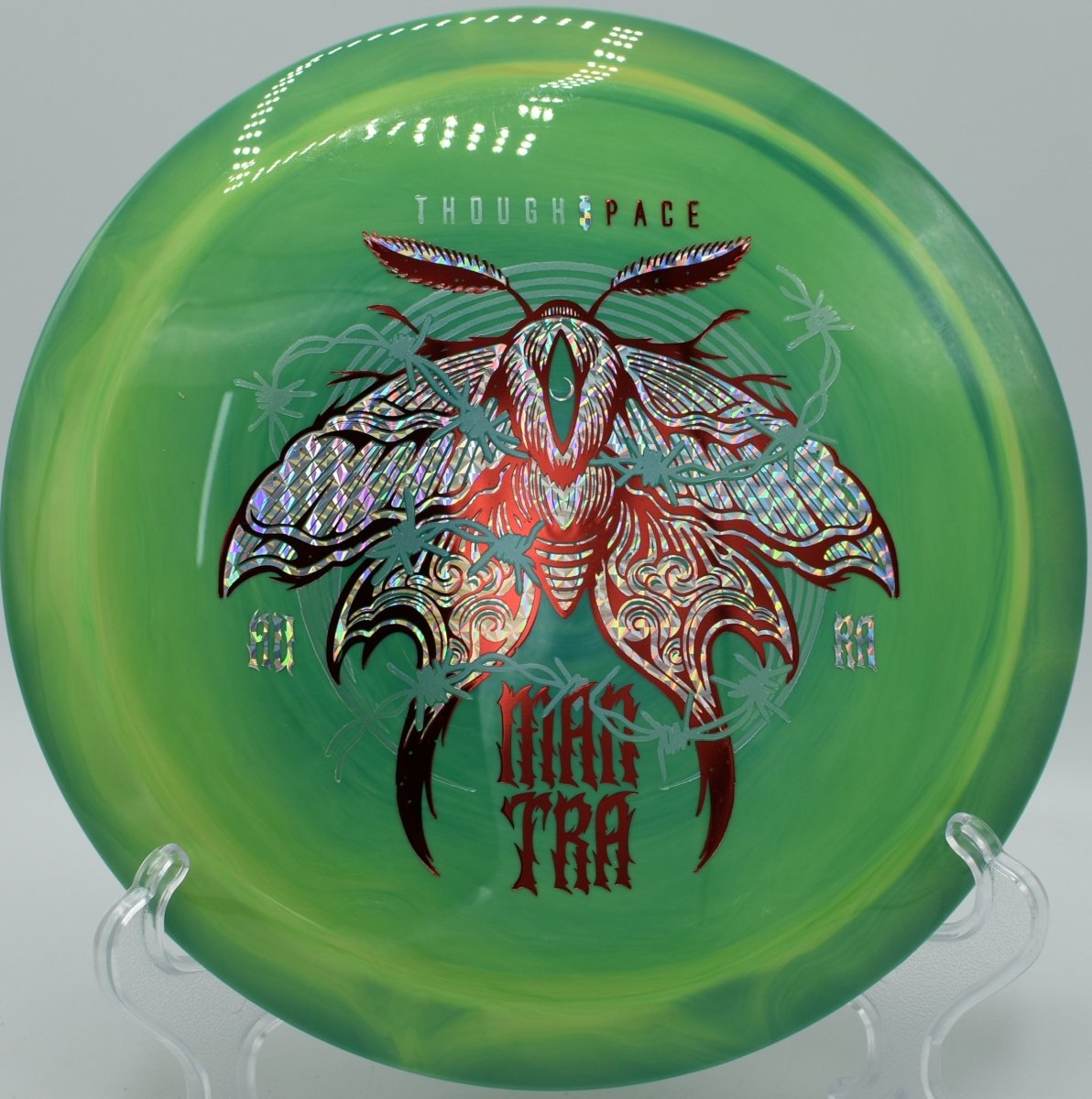 Mantra fairway driver carving a precise hyzer flip through trees at Heritage Park Disc Golf Course in Belton, Texas