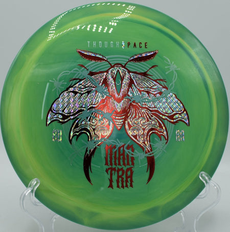 Mantra fairway driver carving a precise hyzer flip through trees at Heritage Park Disc Golf Course in Belton, Texas