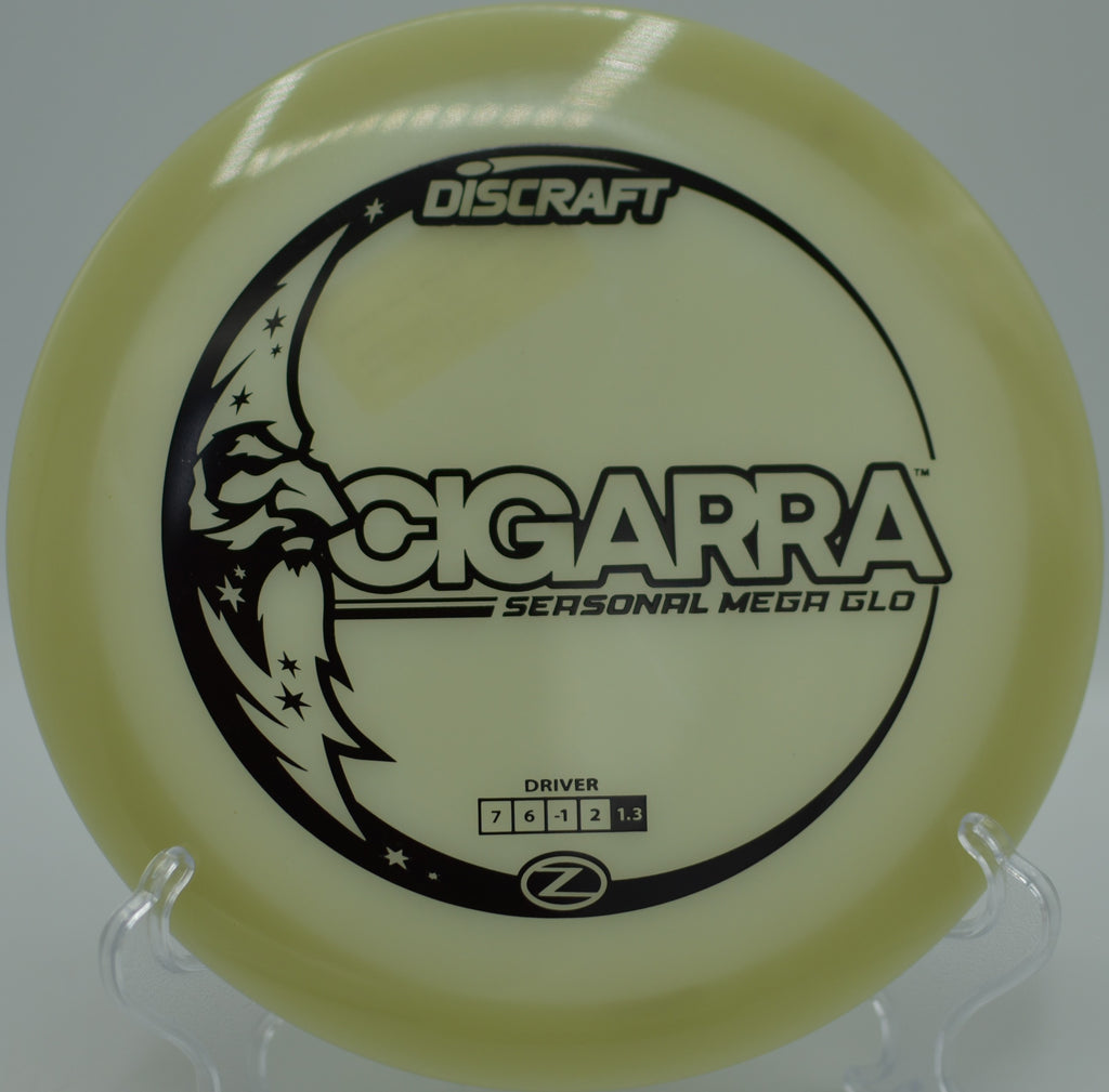 Mega Glow Z Cigarra glowing bright during a flex shot at Blue Ribbon Pines Disc Golf Course in East Bethel, Minnesota.