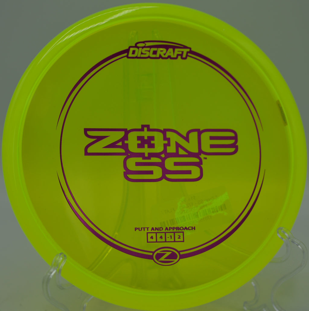 Discraft Z Zone SS settling under the basket at Z Boaz Disc Golf Course in Fort Worth, Texas.