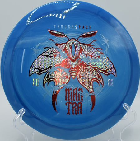 TSA Mantra driver gliding across fairway on a controlled distance shot at Spring Valley Disc Golf Course in Elyria, Ohio