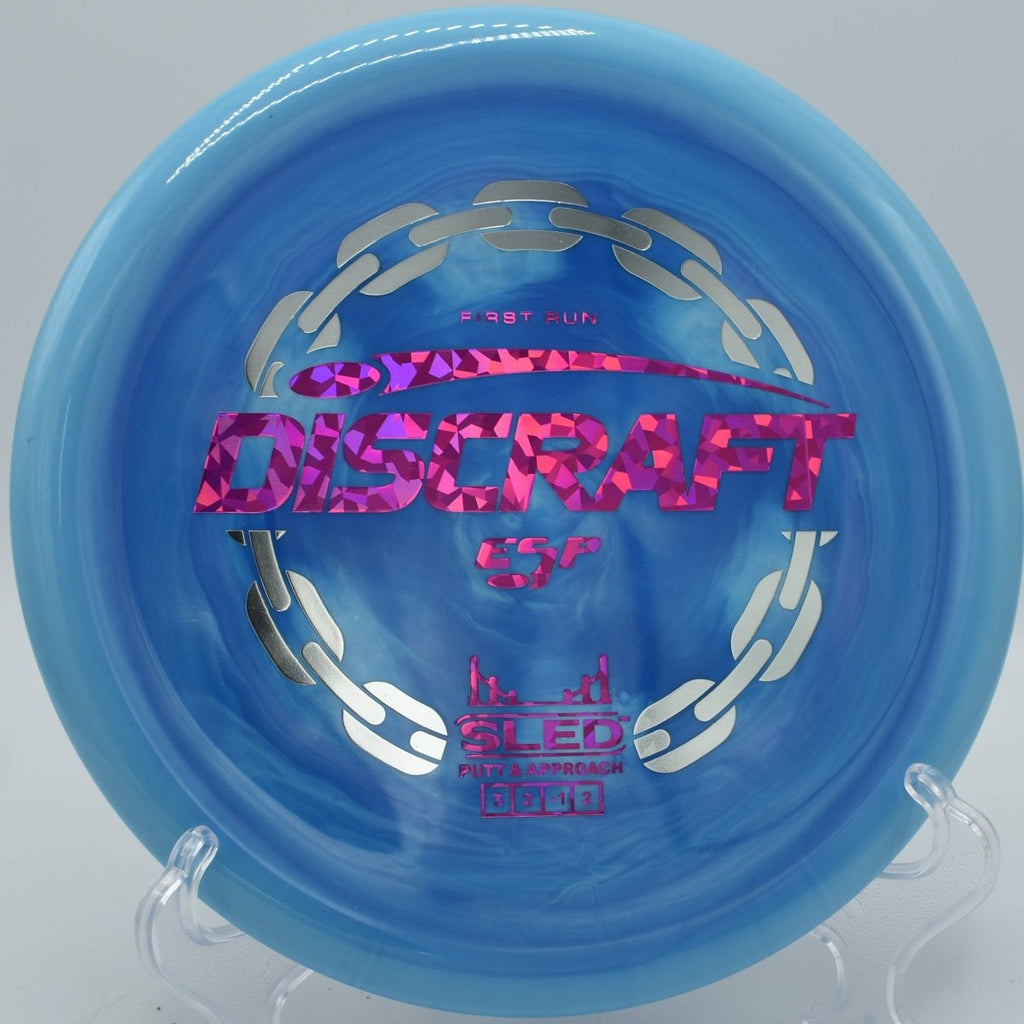 Discraft First Run ESP Sled stable upshot under chains at Johnson Street Disc Golf Course in High Point, North Carolina