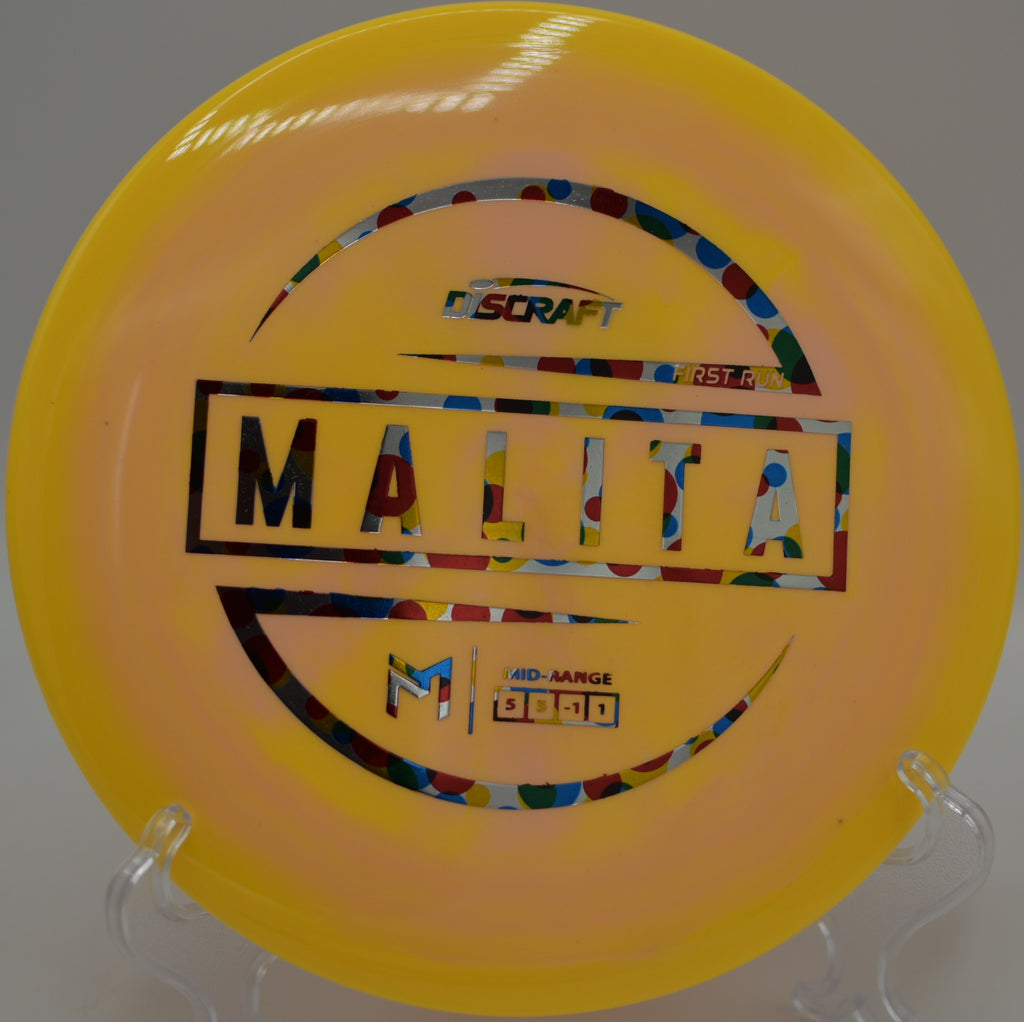 Player releasing a Paul McBeth ESP Malita on a low-ceiling approach shot at Bloomington Disc Golf Course in Bloomington, Indiana.