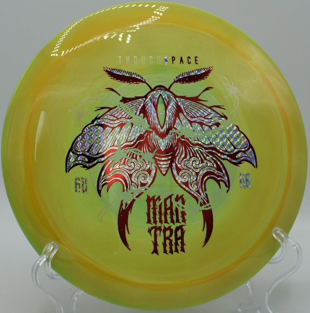 Mantra fairway driver executing a finesse approach shot toward chains at Fox Prairie Disc Golf Course in Noblesville, Indiana