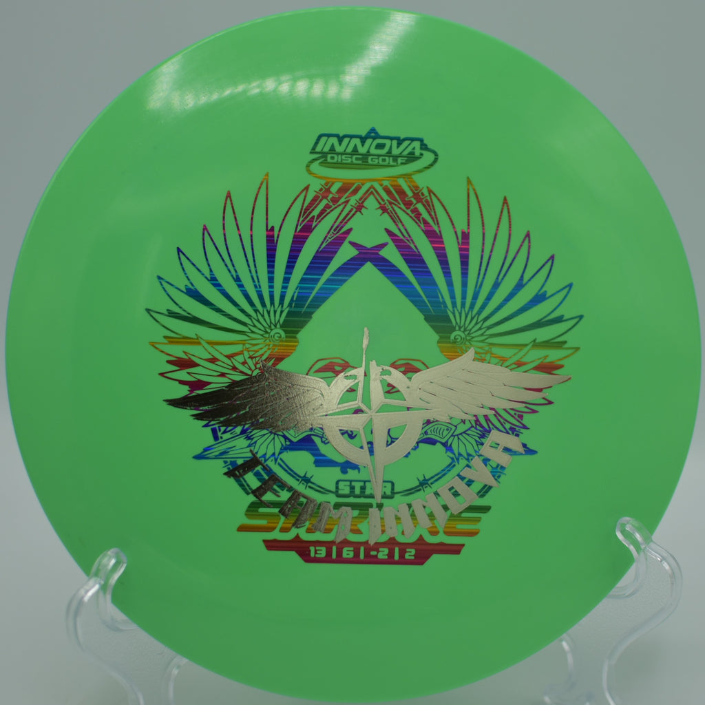 Player launching a Star Shryke Team Stamp for maximum distance at Jones Park Disc Golf Course in Emporia, Kansas.