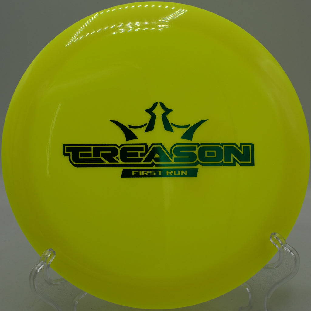 Dynamic Discs Treason First Run Fuzion plastic disc parked on a hyzer-flip at DeLaveaga Disc Golf Course in Santa Cruz, California.