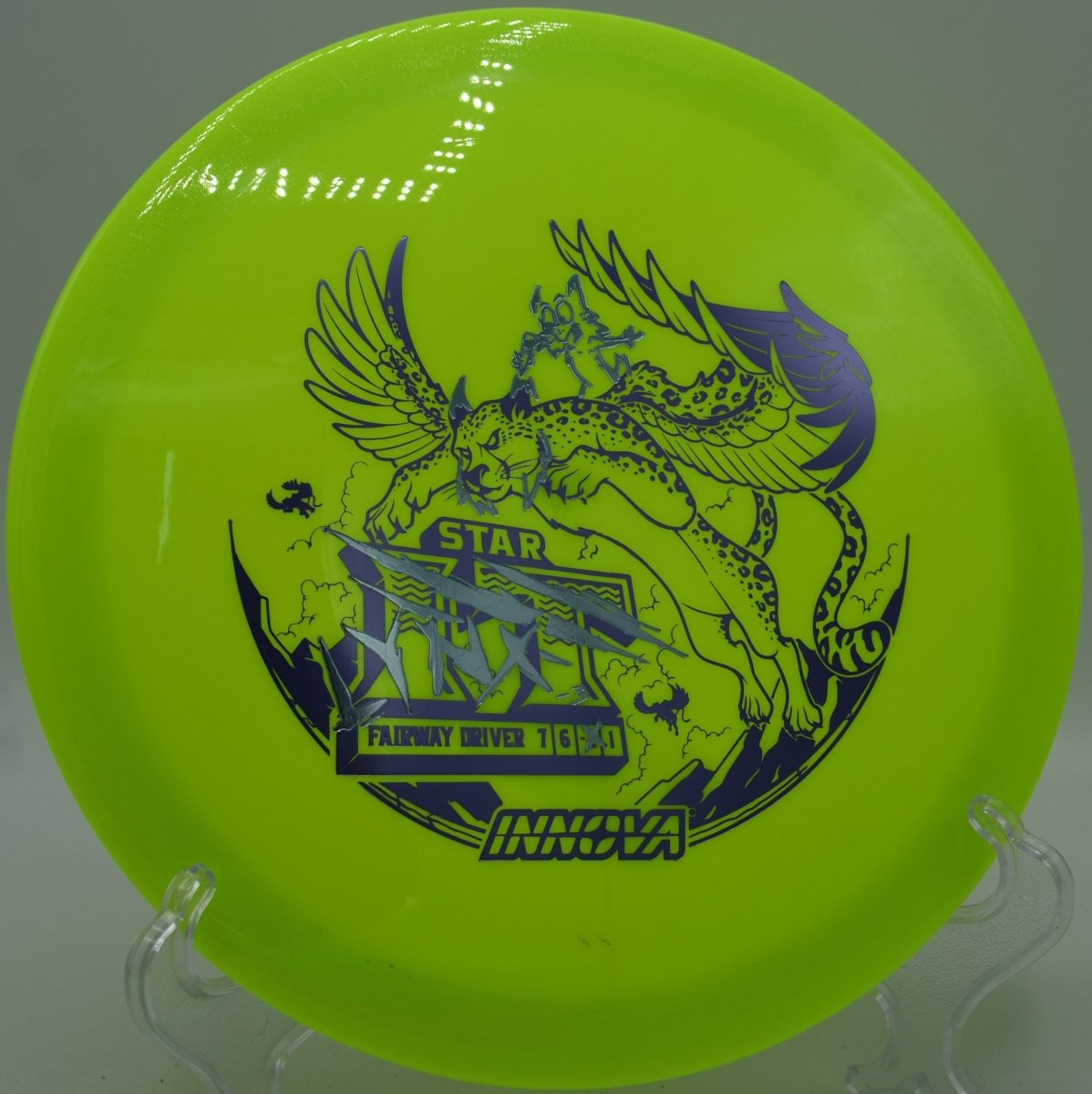 Star Lynx fairway driver holding a long turnover line through woods at Cedar Grove Disc Golf Course in Kingwood, West Virginia