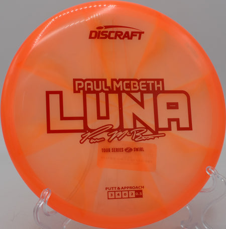 Z Swirl Luna showcasing premium plastic finish during a tournament drive at Black Falcon DGC in Kentwood, Michigan.

