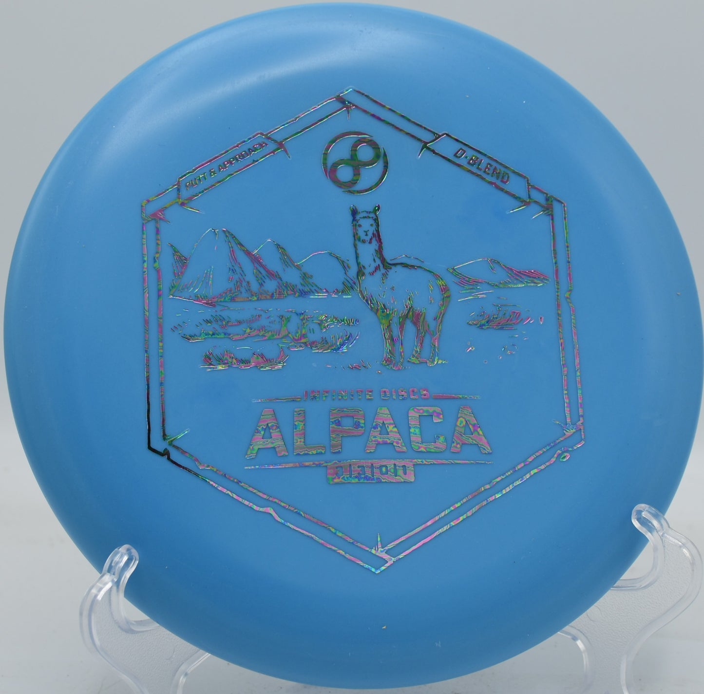 D-Blend Alpaca thrown backhand from the fairway, holding a slight anhyzer and landing flat at Stafford Woods.

