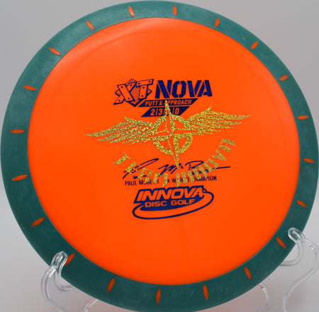 4X XT Nova (Team Stamp) putter displayed on the tee pad at Winthrop Gold in Rock Hill, South Carolina, showing off its grippy XT overmold construction and commemorative team stamp for precise, low-glide approaches.







