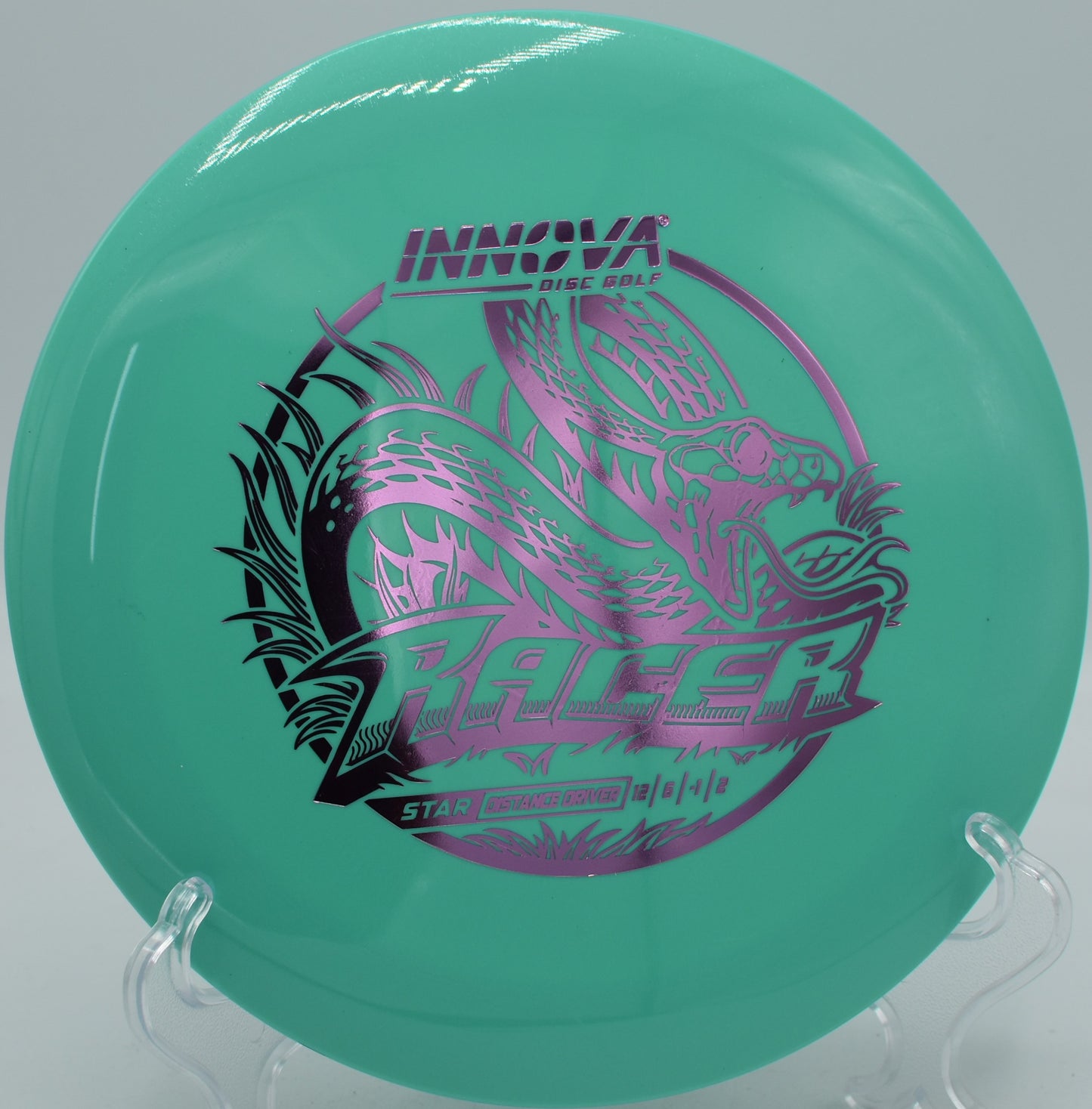 Star Racer driver ripping down the fairway at Deer Lakes Disc Golf Course in Tarentum, Pennsylvania, showcasing its long, torque-resistant flight