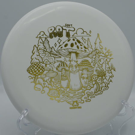 Doomsday Discs Rot soft plastic putter resting near chains after a glidey approach at Bicentennial Park Disc Golf Course in Grand Junction, Colorado