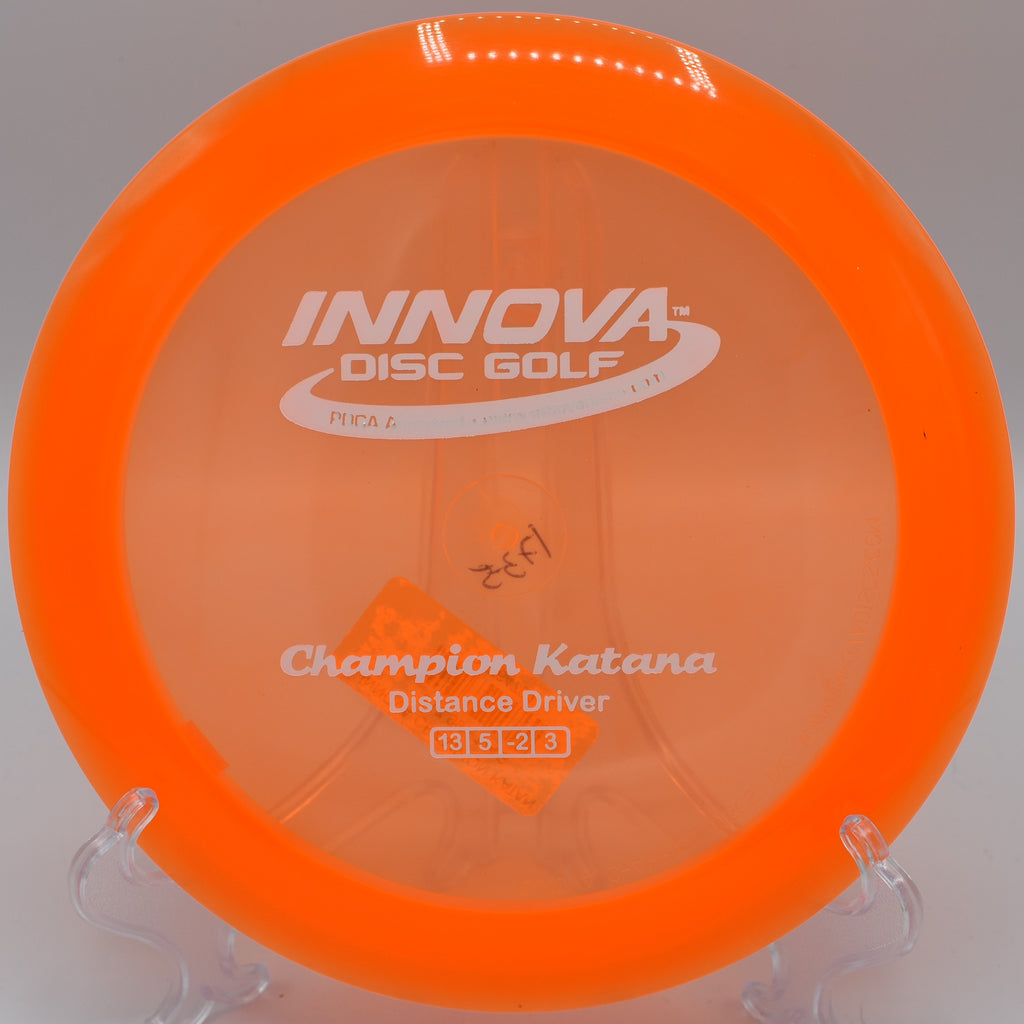 An Innova Champion Katana cutting through the wind on hole 18 at Jonesboro Disc Golf Course in Jonesboro, Arkansas, achieving a full S-curve flight.