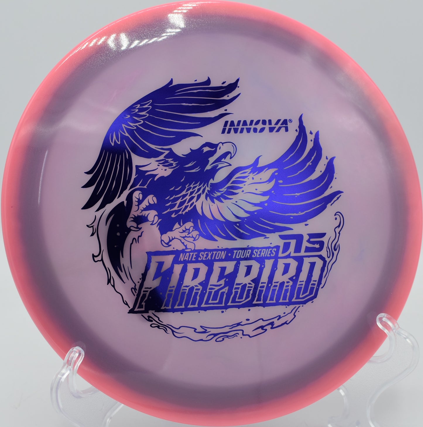 2025 Sexton Firebird fading sharp around an obstacle at Maple Hill Disc Golf Course in Leicester, Massachusetts.

