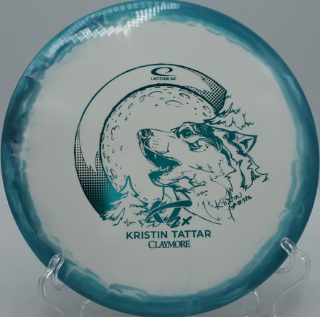 Latitude 64° Gold Orbit Claymore 2024 Kristin Tattar signature disc floating approaches at Circle C Ranch Disc Golf Course in Austin, Texas.