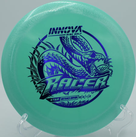 Disc golfer launching an Innova Star Racer on a powerful backhand flex line at Moraine State Park in Portersville, Pennsylvania