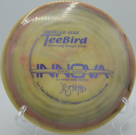 KJ Nybo 10X Swirled Star TeeBird caught mid-flight on a laser-straight line at Flip City Disc Golf Park in Shelby, Michigan, ideal for technical fairway shots.

