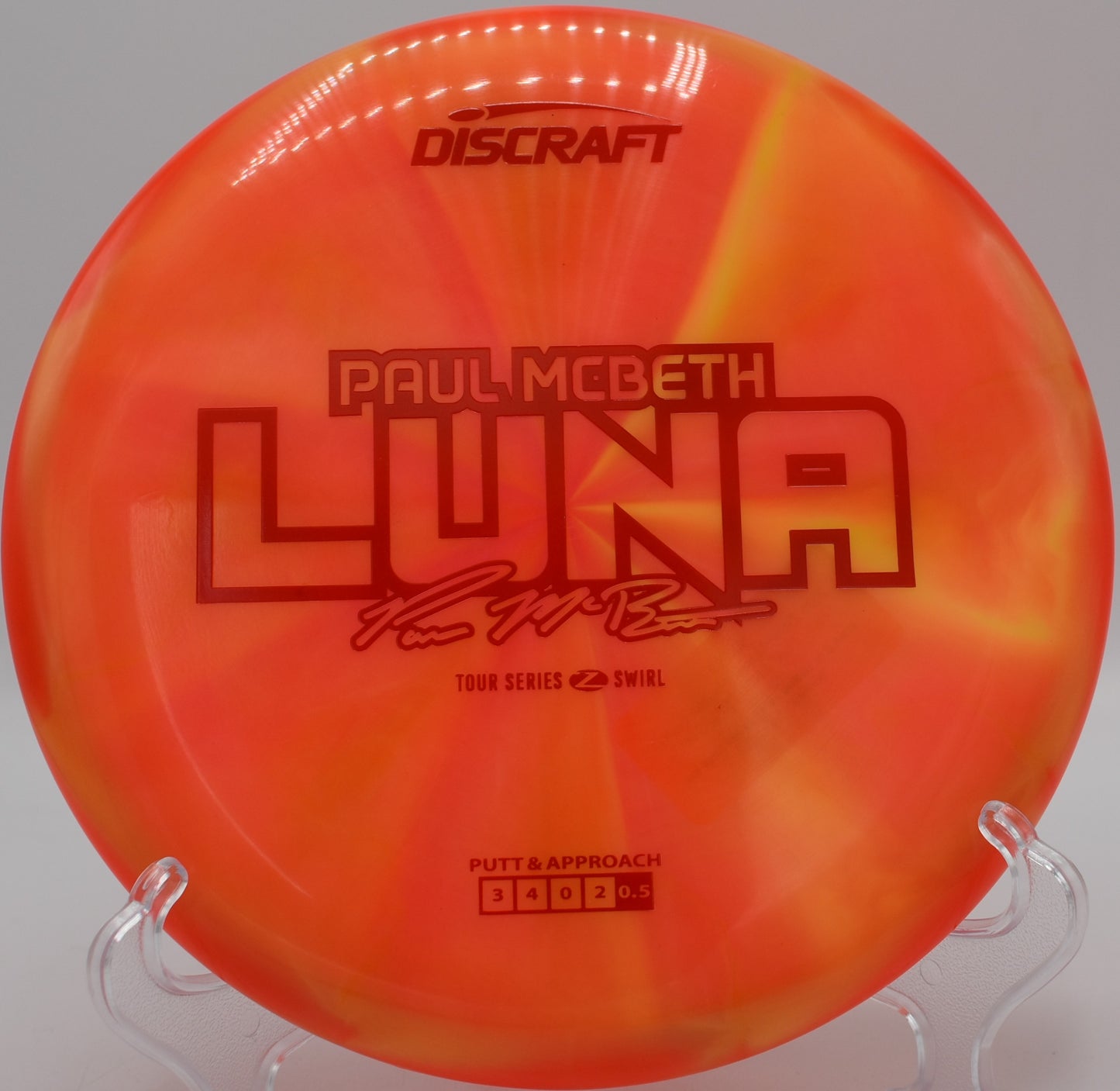 Discraft Z Swirl Luna resting on moss at Moraine State Park in Portersville, Pennsylvania, built for precision approaches and clean releases.

