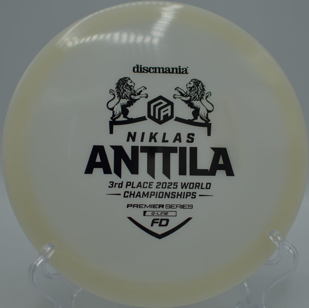 Discmania Q-Line FD shining under sunbeams during a long glide shot at Fountain Hills Disc Golf Course in Fountain Hills, Arizona.