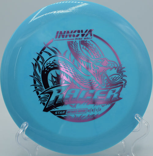 Vibrant Star Racer carving through a tight wooded tunnel shot at Flip City Disc Golf Park in Shelby, Michigan