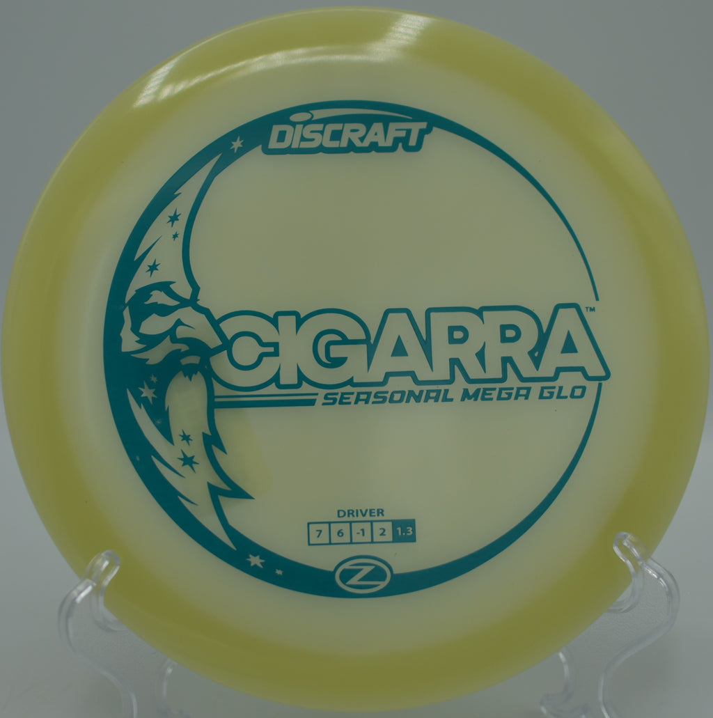 Mega Glow Z Cigarra glowing orange during a forehand release at The Beast Disc Golf Course in Waco, Texas.