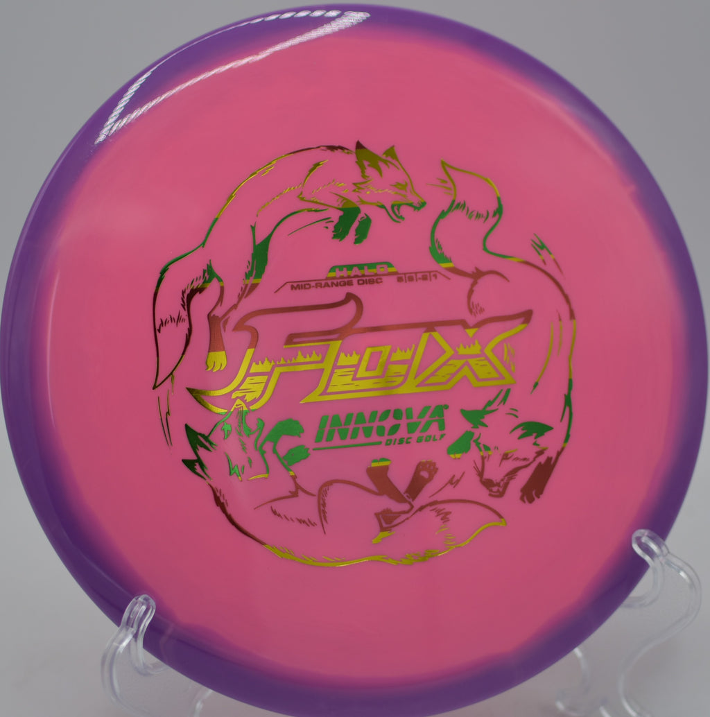 Innova Halo Star Fox flying over a small hill with gentle finish at Waterworks Park Disc Golf Course in Kansas City, Missouri.