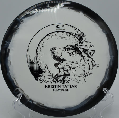 Latitude 64° Gold Orbit Claymore 2024 Kristin Tattar signature disc floating approaches at Circle C Ranch Disc Golf Course in Austin, Texas.