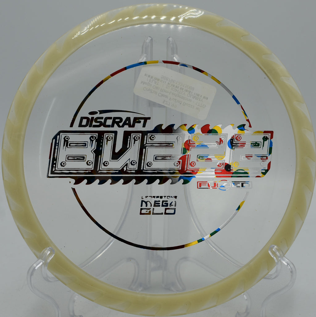 Discraft CryZtal FLX BuzzzSaw glowing hard during twilight league at Pier Park, OR