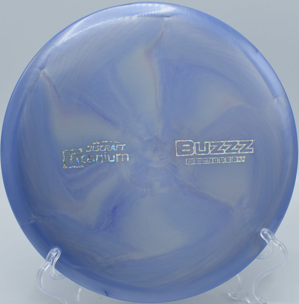 Titanium Buzzz by Discraft – 5/4/-1/1 flight path, perfect for straight shots, turnovers, and touchy upshots, with durable Titanium plastic.