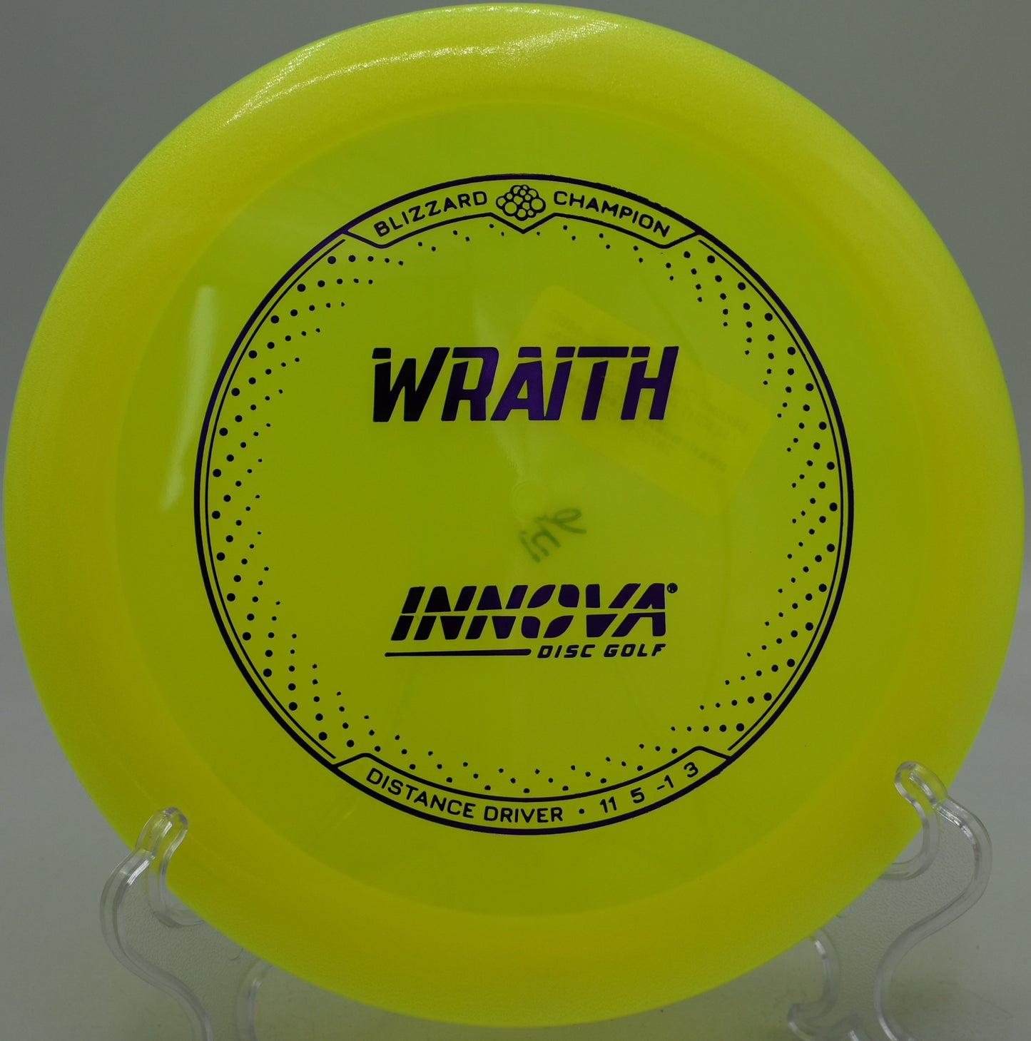 Blizzard Champion Wraith holding a wide hyzer flip at Gaffney's Grove in Maple Valley, Washington
