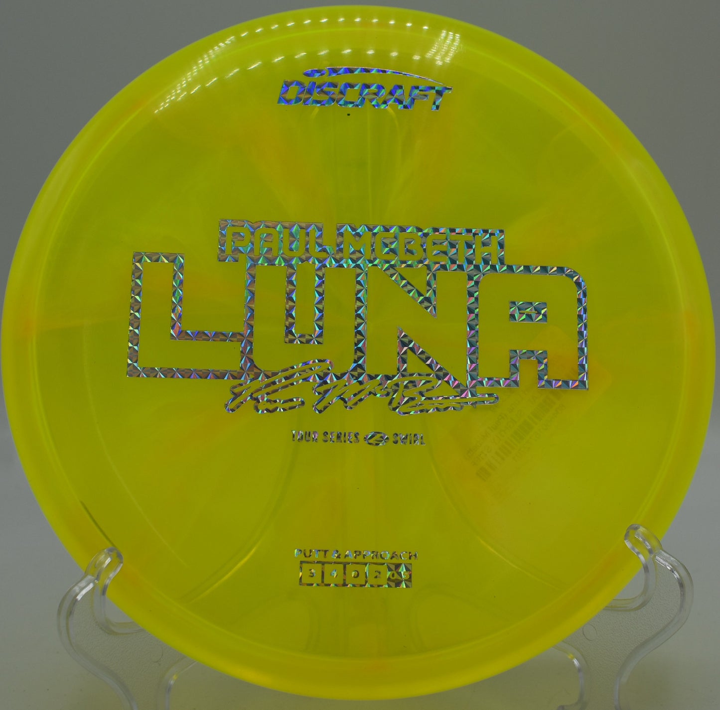 Z Swirl Luna hovering above the circle at Lake Marshall Disc Golf Course in Montross, Virginia, trusted for controlled spin putts and fade-stable upshots.

