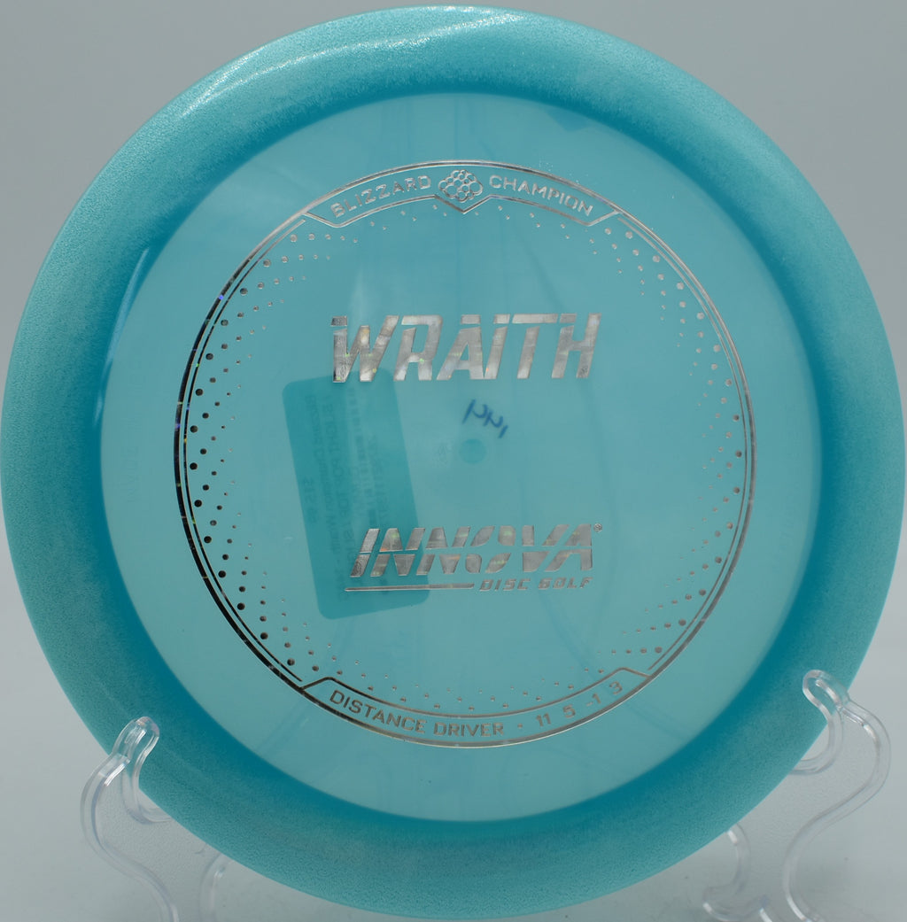 Disc golfer unleashing a low-effort drive with the Blizzard Wraith at Pier Park in Portland, Oregon