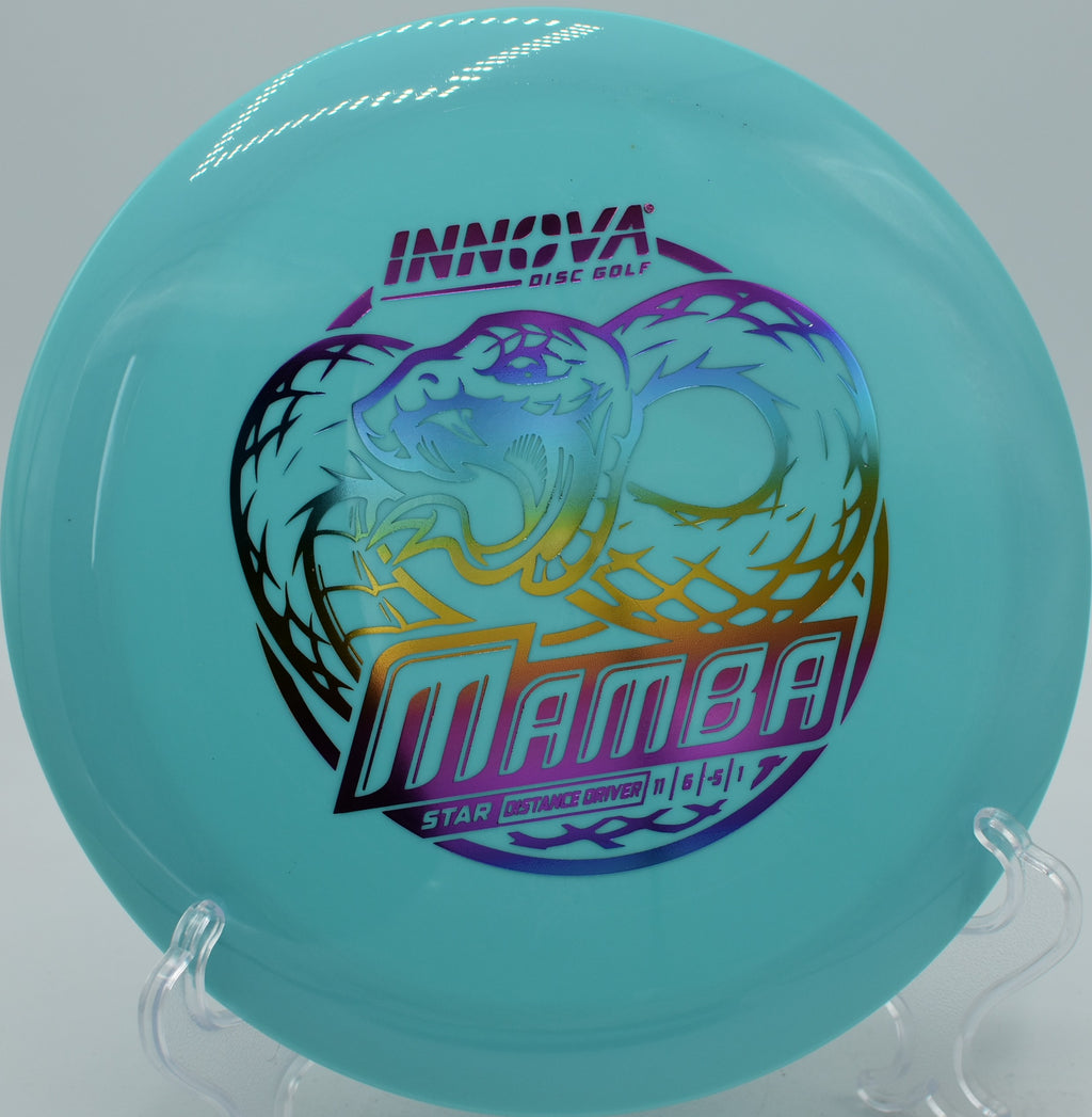 Smooth Star Mamba hyzer-flip shot carrying long glide at Blue Ribbon Pines Disc Golf Course in East Bethel, Minnesota