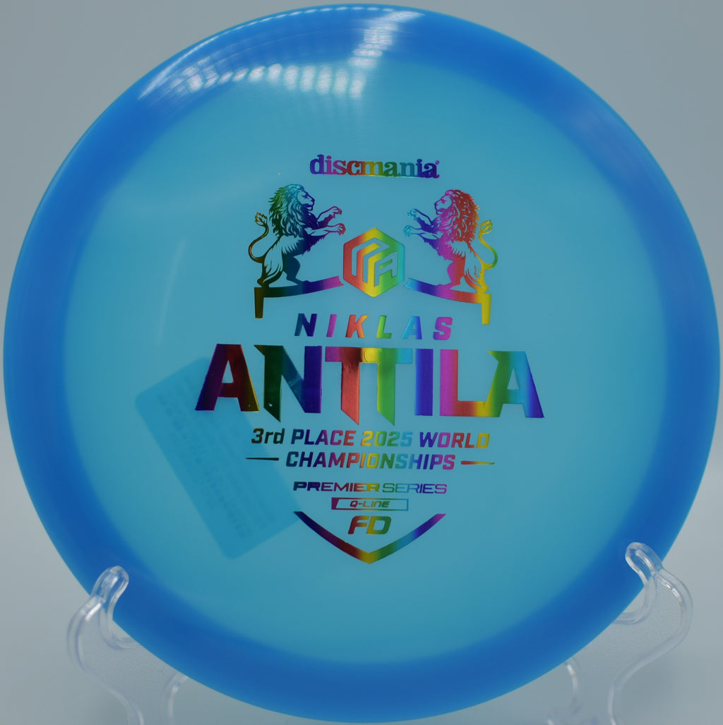 Discmania Q-Line FD resting beside the basket after a perfect hyzer-flip at Hornings Hideout Disc Golf Course in North Plains, Oregon.