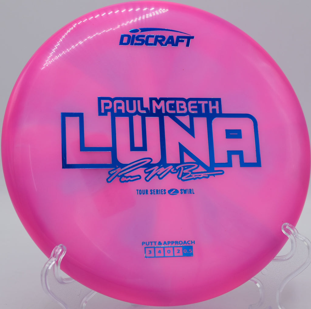 Paul McBeth Z Swirl Luna gliding through trees at Hornets Nest DGC in Charlotte, North Carolina, built for confident circle 2 runs and soft landings.

