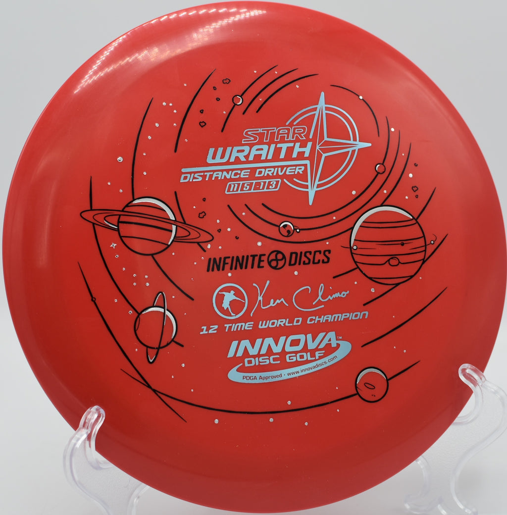 Close-up of Innova Star Wraith on the teepad at Idlewild Disc Golf Course in Kentucky, highlighting its tour-grade plastic and balanced overstability.

