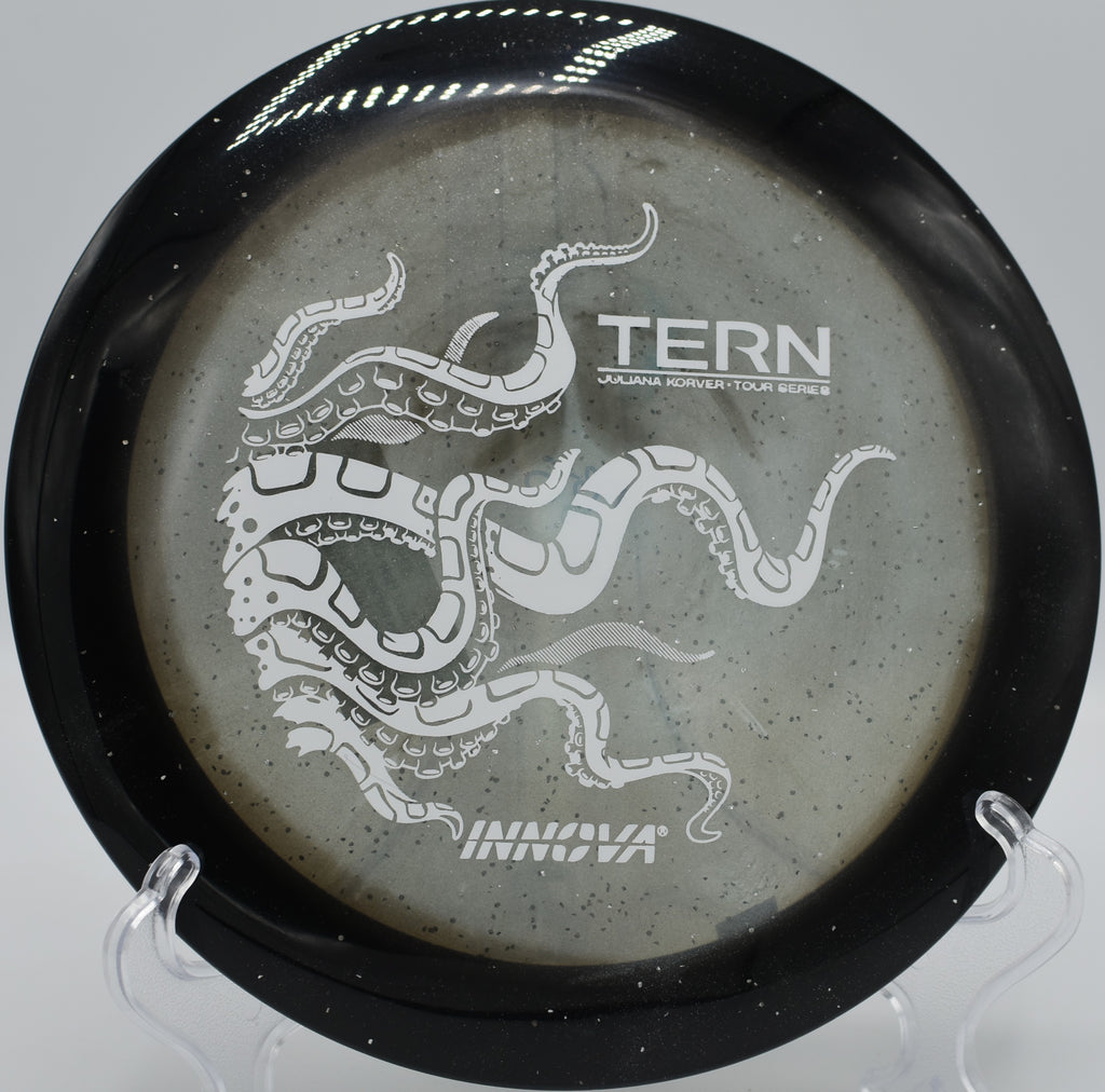 Juliana Korver Tour Series Tern soaring over a wooded fairway gap at Sabattus Disc Golf Complex in Sabattus, Maine.

