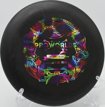 Innova Big Bead Aviar nestling under the basket after a hyzer approach at Milo McIver State Park in Estacada, Oregon.

