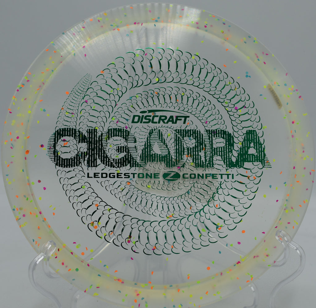 Discraft Confetti Z Cigarra launched forehand at Flat Creek DGC in Marble Falls, Texas