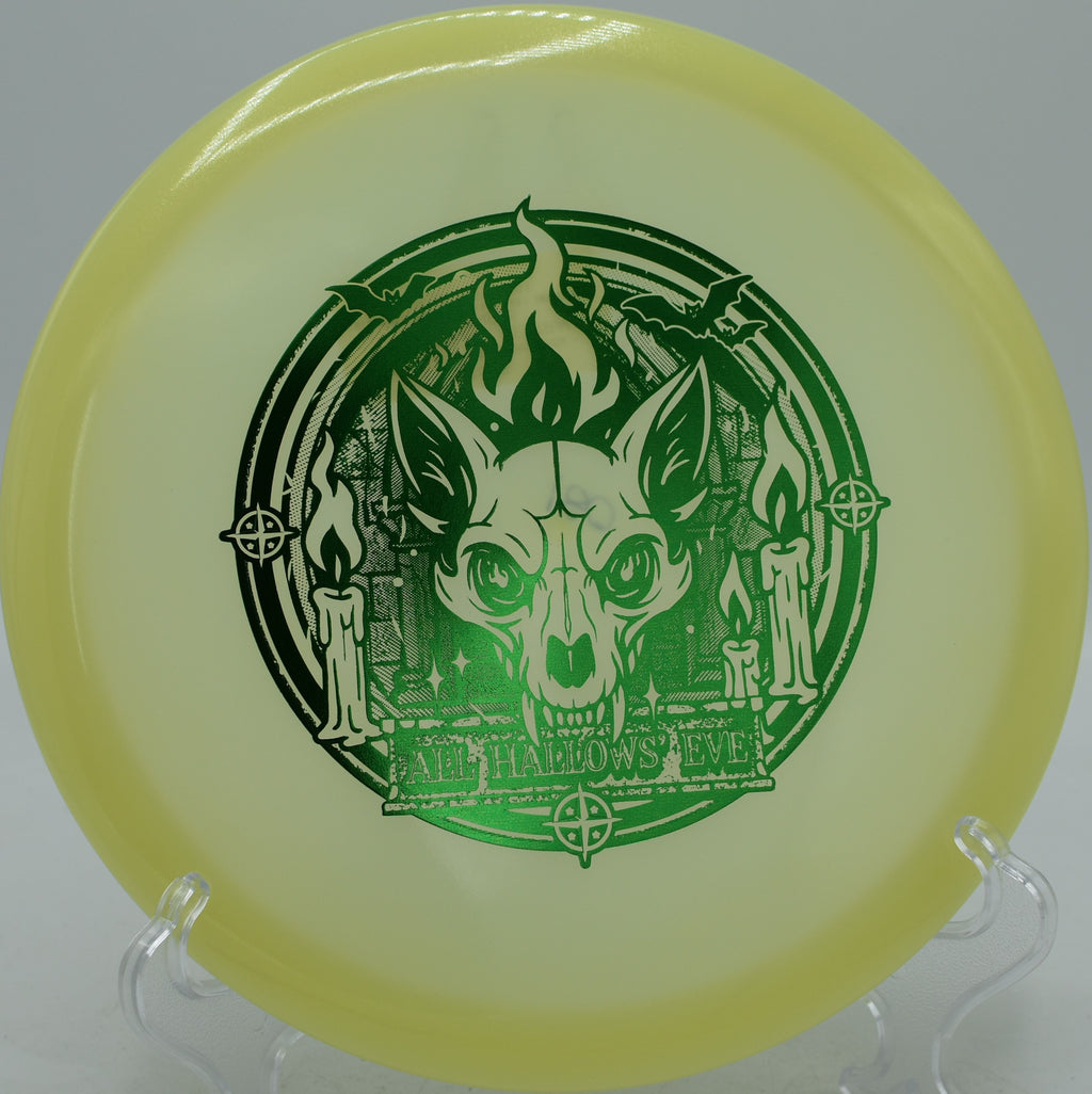 Glow Champion Fox disc gliding long on a hyzer-flip at Harmon Hills Disc Golf Course in Fall Branch, Tennessee