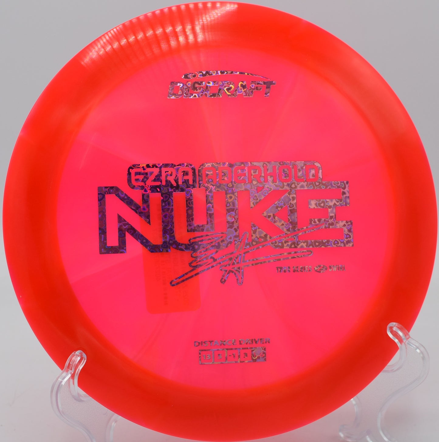 Discraft Z Swirl Nuke soaring over the fairway at Harmony Bends in Columbia, Missouri

