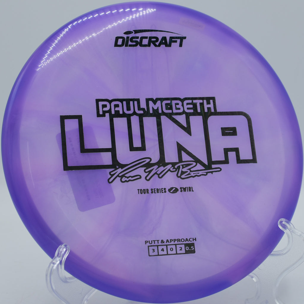 Swirly Z Luna hovering over a rocky green at Persimmon Ridge DGC in Louisville, Kentucky, combining premium grip and pinpoint consistency.

