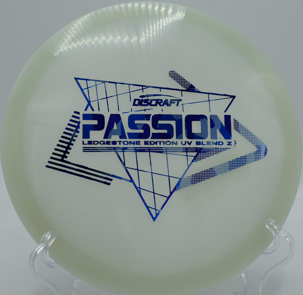 UV Z Passion mid-flight on a straight fairway drive at Maple Hill Disc Golf Course in Massachusetts, showing off its consistent glide and turn