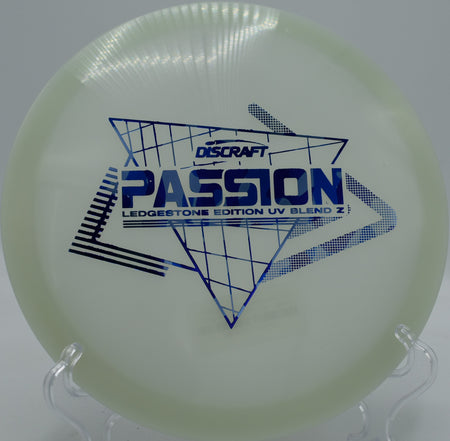 Throwing the Paige Pierce UV Z Passion on a controlled turnover line at Tyler State Park Disc Golf Course, delivering pinpoint placement through narrow gaps