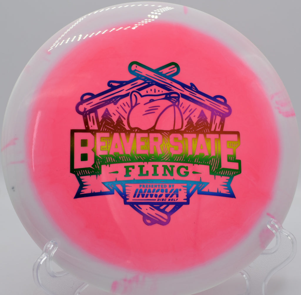 Halo Star Valkyrie driver spinning through a wooded fairway at Brockwood Park Disc Golf Course in Apopka, Florida, featuring eye-catching rim contrast and dependable understable flight for controlled distance lines.