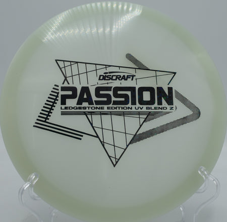 UV-reactive Z Passion glowing purple while executing a standstill shot through dense trees at Trophy Lakes in Charleston, South Carolina