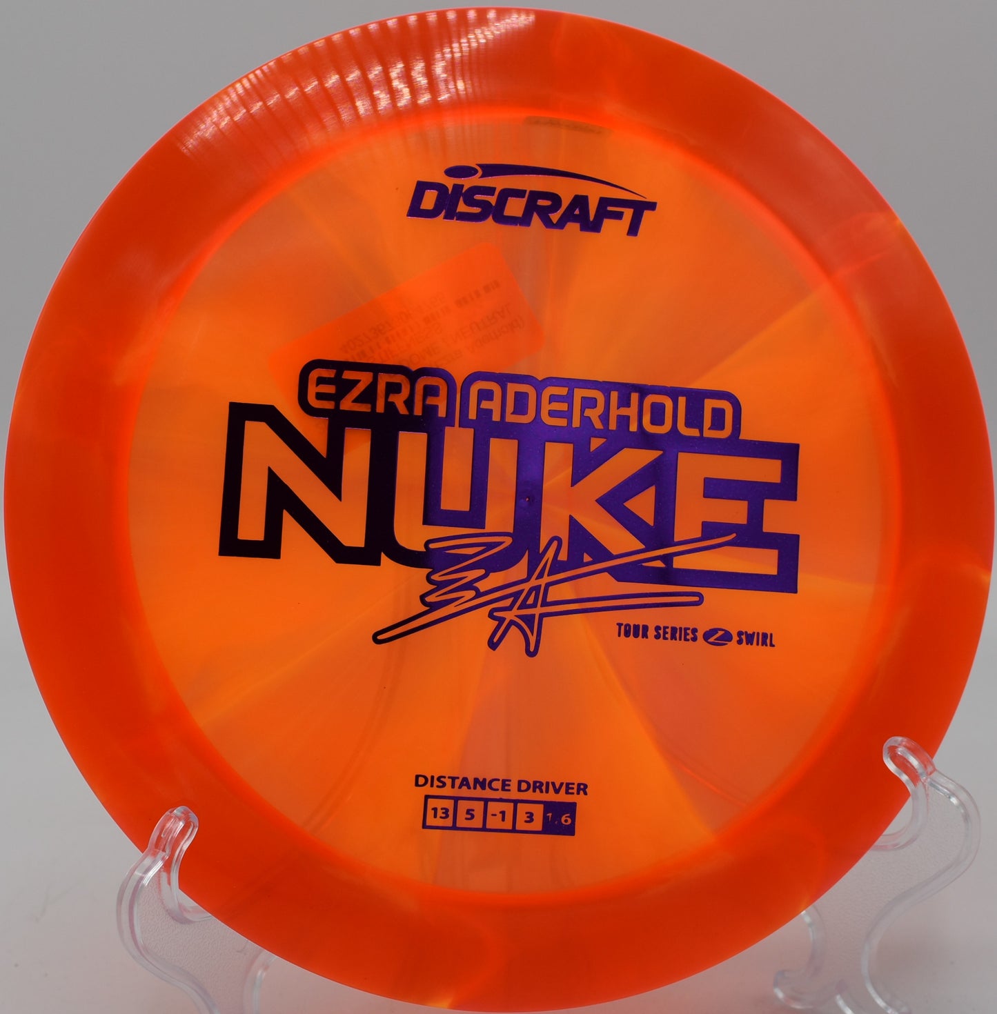 Grip shot of Z Swirl Nuke during run-up at Trophy Club Disc Golf Course in Texas

