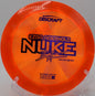 Grip shot of Z Swirl Nuke during run-up at Trophy Club Disc Golf Course in Texas


