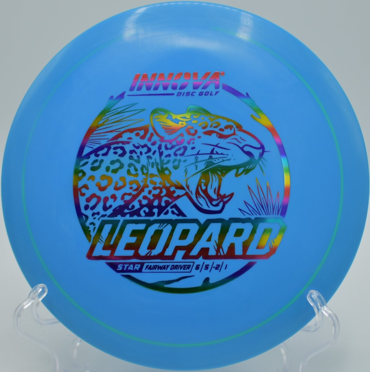 Innova Star Leopard driver resting beside chains after a smooth approach shot at Cedar Hill Park Disc Golf Course in Nashville, Tennessee