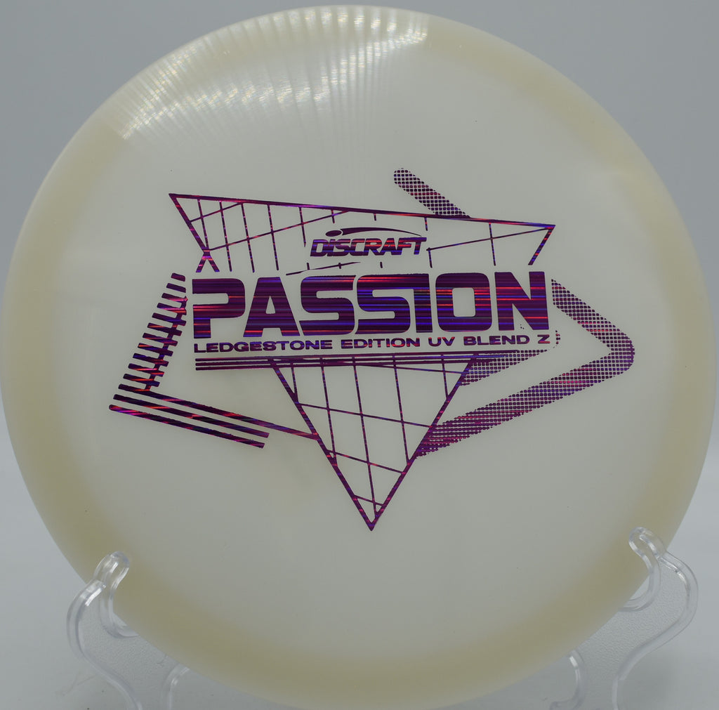 Paige Pierce UV Z Passion ripping through the fairway at Kensington Metropark in Michigan, showcasing effortless glide and subtle turn